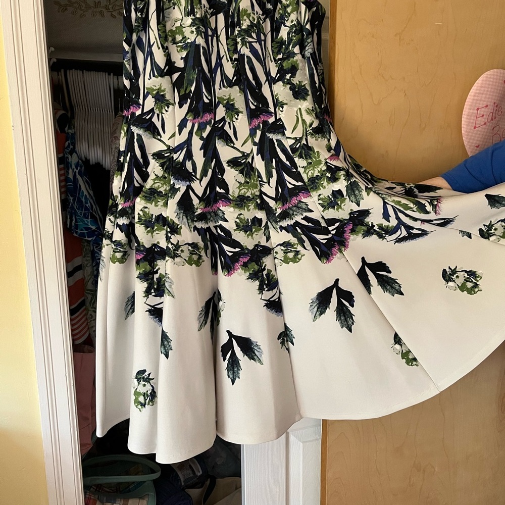 dress,a flair skirt and colors navy, green, and rose .